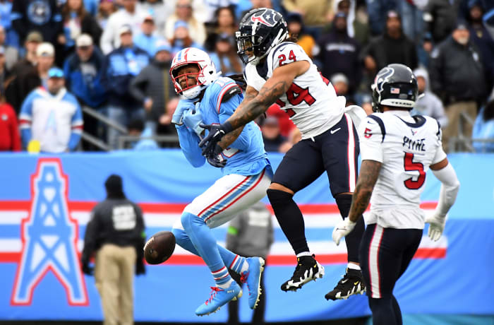 Titans' wide receiver DeAndre Hopkins has a pass broken up by Houston Texans cornerback Derek Stingley Jr. during the second half at Nissan Stadium.